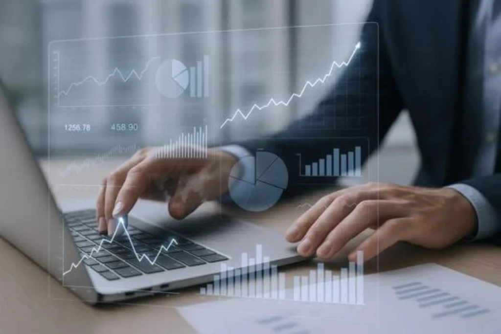 Billing analyst reviewing claims compliance data and revenue trends on a laptop